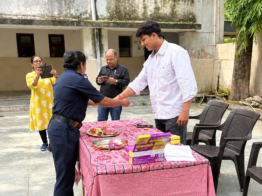 A rakhi tied with a member of the care staff