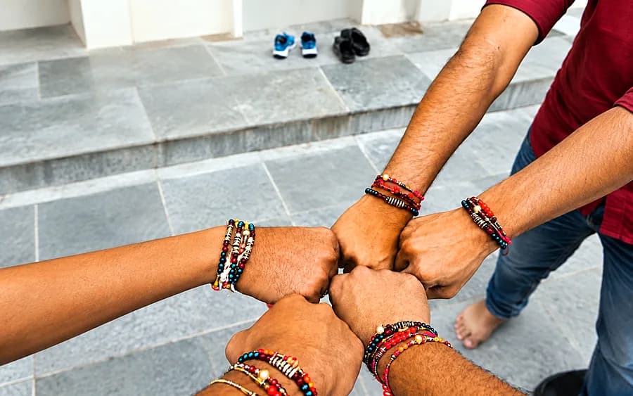 Hands wearing rakhis